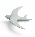 Hirondelle mate minérale blanche en porcelaine.