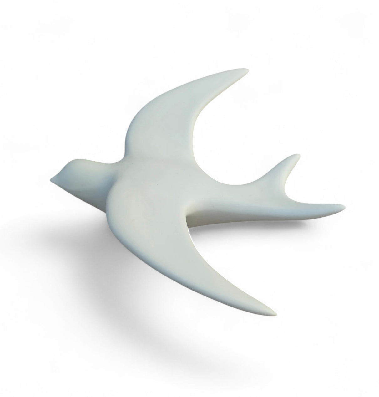 Hirondelle mate minérale blanche en porcelaine.
