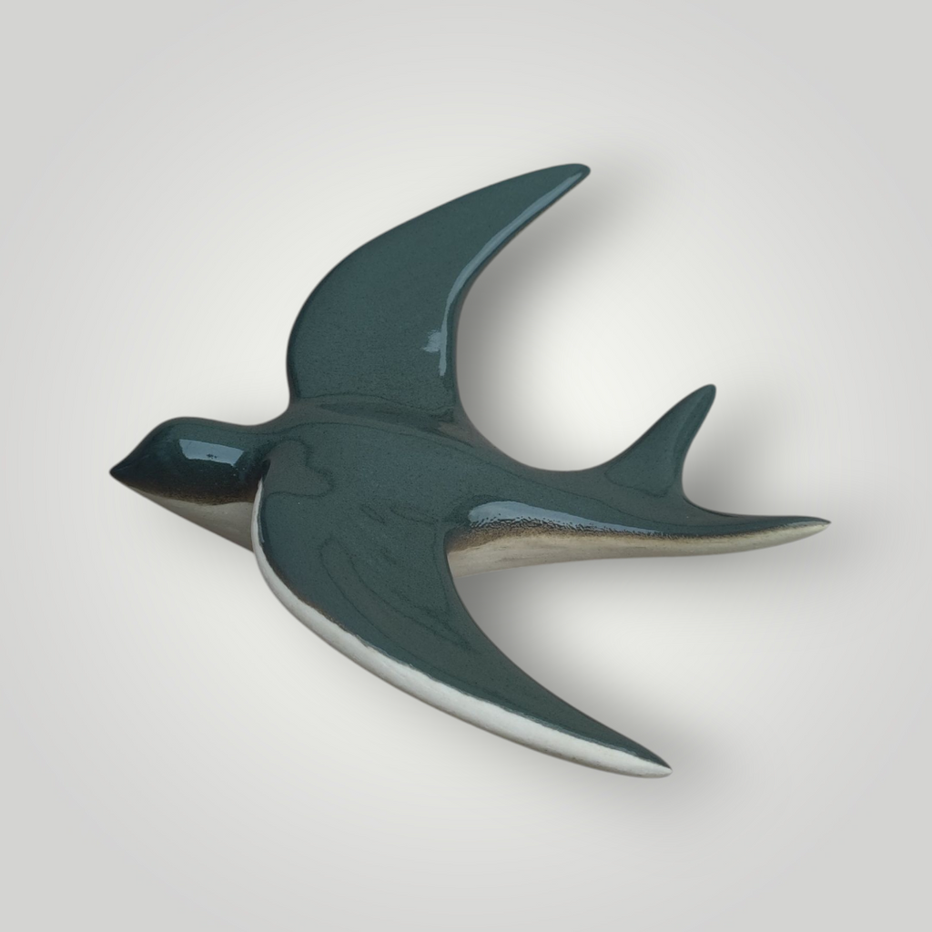 Hirondelle murale vert bouteille dégradée en céramique.